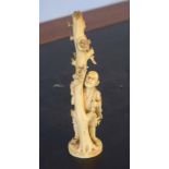 Ivory figure of a man against a tree with birds nest above, 17cm high