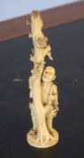 Ivory figure of a man against a tree with birds nest above, 17cm high