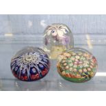 Group of three paperweights