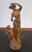 Late 19th/early 20th century French spelter group, dancing female and cupid, 41cm high