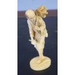Ivory figure of a woodcutter, Meiji period, 15cm high, signature to base