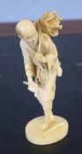 Ivory figure of a woodcutter, Meiji period, 15cm high, signature to base