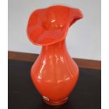 Swedish art glass vase in orange with flared top, maker's sticker to side