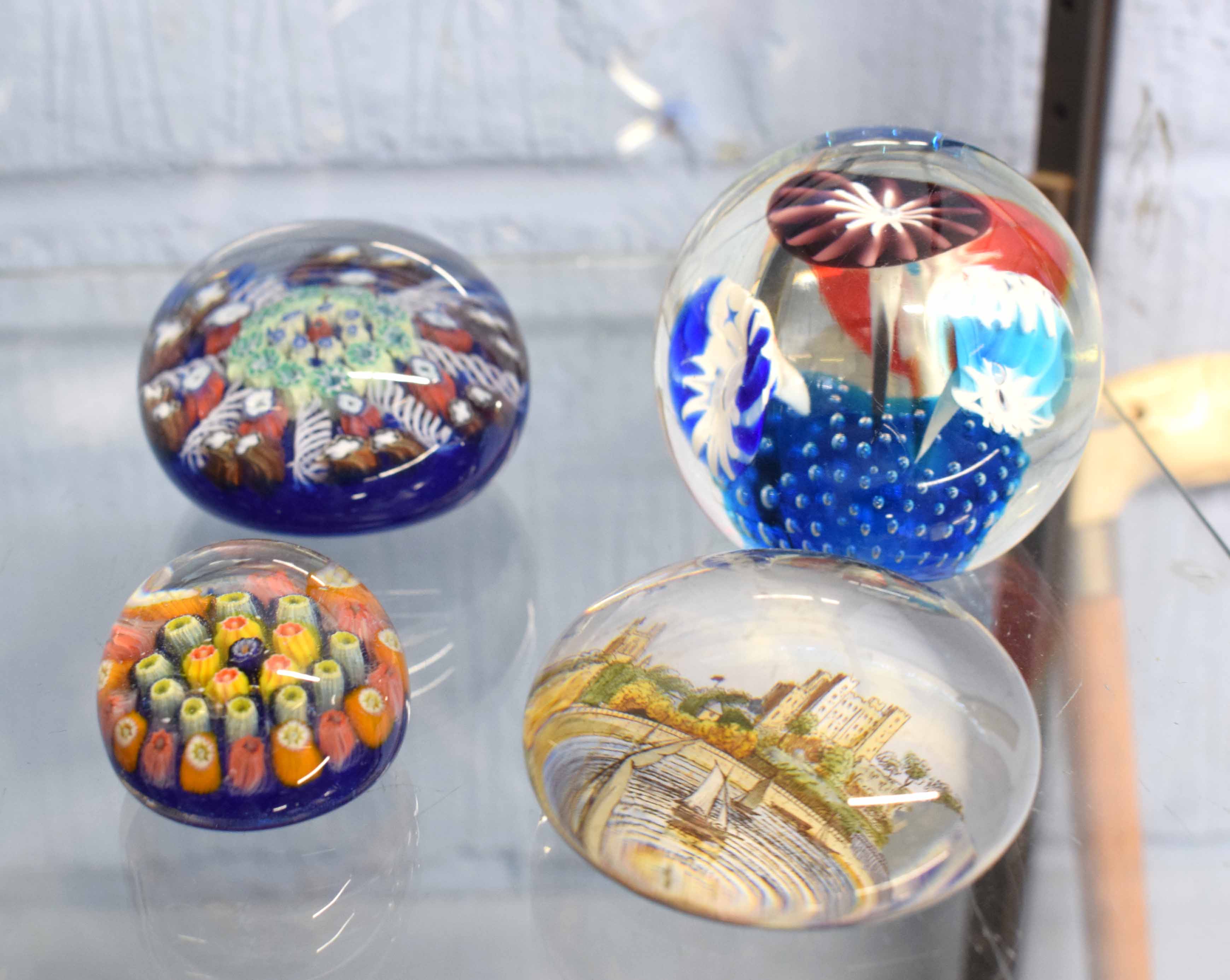 Group of four paperweights