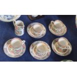 Part Chinese porcelain tea set, comprising five cups and saucers decorated in famille rose designs