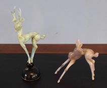 Two models of deer on raised black base