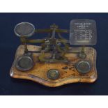 Set of brass postal scales and weights, 19cm wide