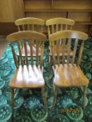 Four wooden kitchen chairs