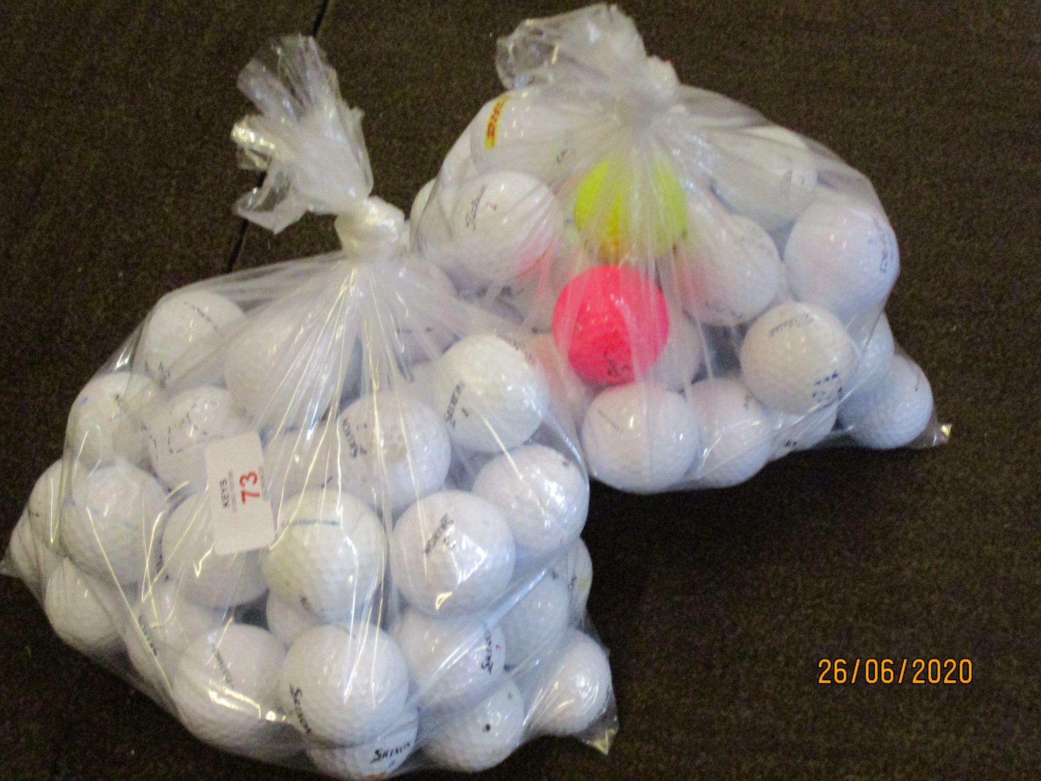 Two bags containing approx 100 golf balls