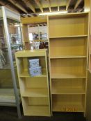 Two modern laminated bookshelves together with two storage boxes