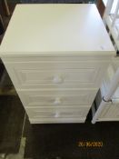 White finished three drawer bedside cabinet