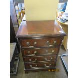 Mahogany veneered four drawer chest