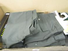 Box containing Dickies workwear trousers