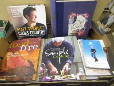 Tray containing various cookbooks