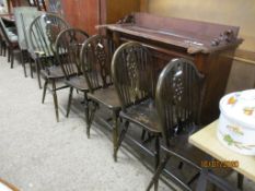 SET OF FIVE MODERN REPRODUCTION WHEEL BACK KITCHEN CHAIRS WITH SOLID SEATS, COMPRISING A CARVER