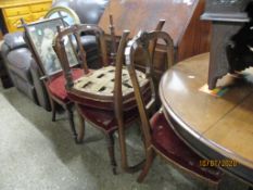 EDWARDIAN WALNUT CARVED SPLAT BACK DINING CHAIRS WITH RED UPHOLSTERED SEATS ON REEDED AND TURNED