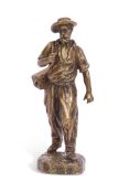 Corolla signed gilt bronze study of a travelling man, circa 1900, standing on an integral socle,