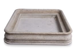 Large marble footbath of square form, moulded edge and plain inner lip, and drilled centre, 108cm