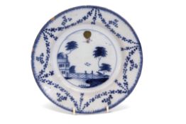 18th century English Delft plate of ballooning interest, the centre painted with a landscape in blue