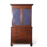 Early 19th century mahogany bookcase cabinet, moulded corners over two brass latticed panelled