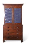 Early 19th century mahogany bookcase cabinet, moulded corners over two brass latticed panelled