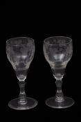 Pair of probably 18th century wine glasses, finely engraved with fruiting vines above a double
