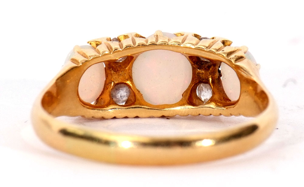 Opal and diamond ring featuring three graduated oval cut cabochon opals, highlighted with four small - Image 3 of 6