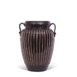Cizhou Chinese pottery black ribbed vase with strap handles, 21cm high