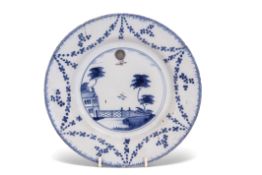 An 18th century English Delft ballooning plate, probably Lambeth, decorated in blue, green and