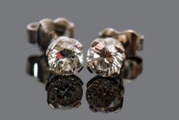 Matched pair of diamond stud earrings, round brilliant cut, four claw set, diamonds 0.75ct approx