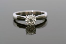 Single stone diamond ring, the brilliant cut diamond of 0.65ct approx, raised between upswept