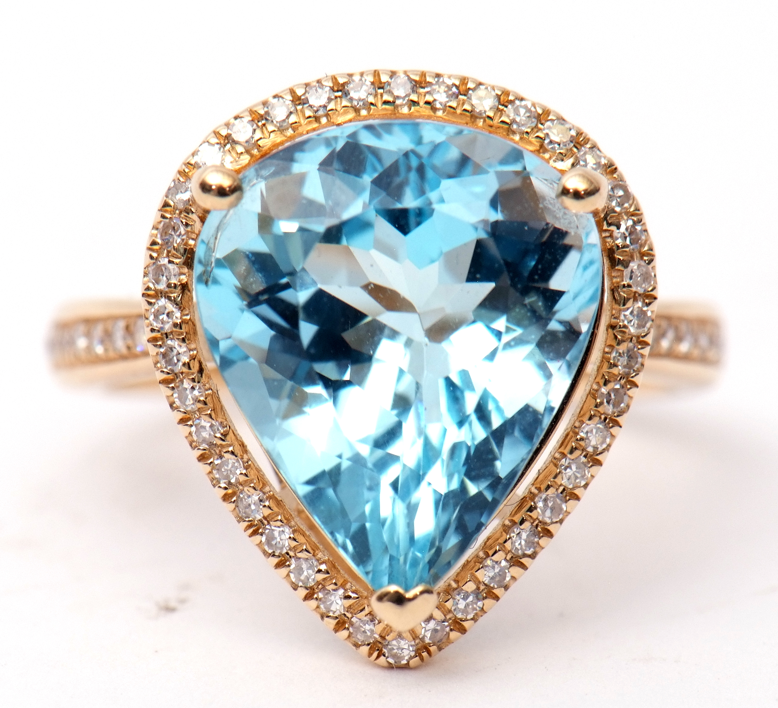 Blue topaz and diamond ring, a pear cut blue topaz, approx 7.48ct set within a diamond surround,