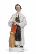 Staffordshire figure of The Rev Thomas Raffles decorated in typical fashion, See Pugh