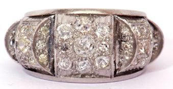 Precious metal and diamond cocktail ring designed as three raised panels, each featuring pave set