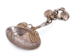 A cast silver and silver-gilt "mussel" caddy spoon, realistically modelled with a shell bowl, the