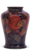 Early 20th century Moorcroft pomegranate vase decorated in typical fashion with pomegranates on a