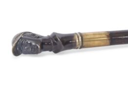 Late 19th/early 20th century walking cane applied with a gilt bronze handle in the form of a