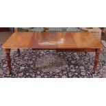 William IV mahogany extending dining table of rectangular design with rounded corners, raised on