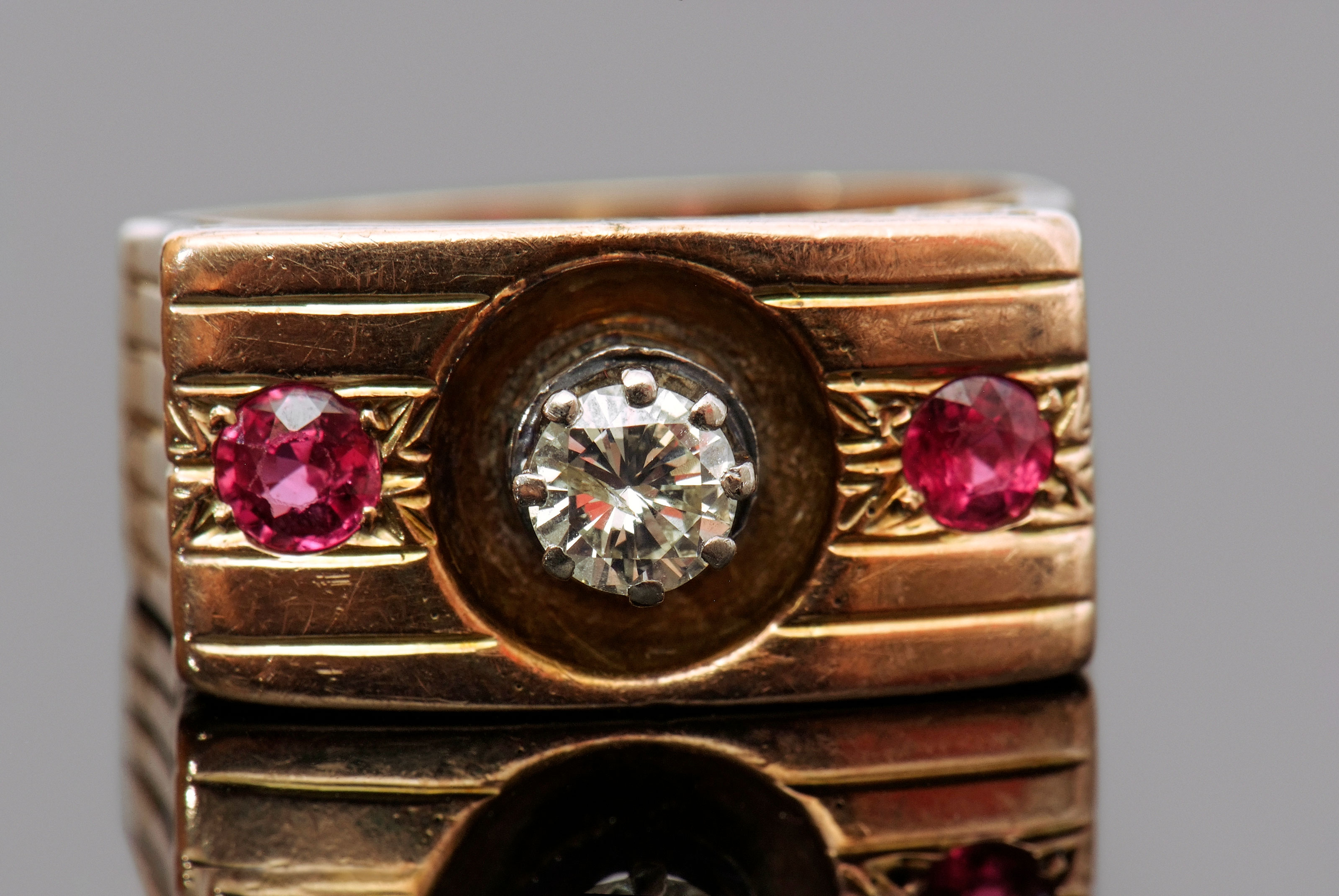 Diamond and ruby ring featuring a round brilliant cut diamond, 0.33ct approx, multi-claw set and