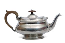 George V silver tea pot of compressed oval form, plain polished body with gadrooned rim and foot,