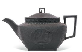 Mid-19th century black basalt tea pot commemorating the death of Lord Nelson with moulded decoration