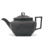 Mid-19th century black basalt tea pot commemorating the death of Lord Nelson with moulded decoration