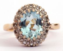 Aquamarine and diamond cluster ring, the oval faceted aquamarine 10 x 8mm, multi-claw set and raised