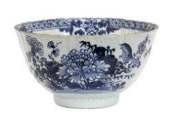 Chinese export porcelain bowl with blue and white decoration of a bird on a branch with floral