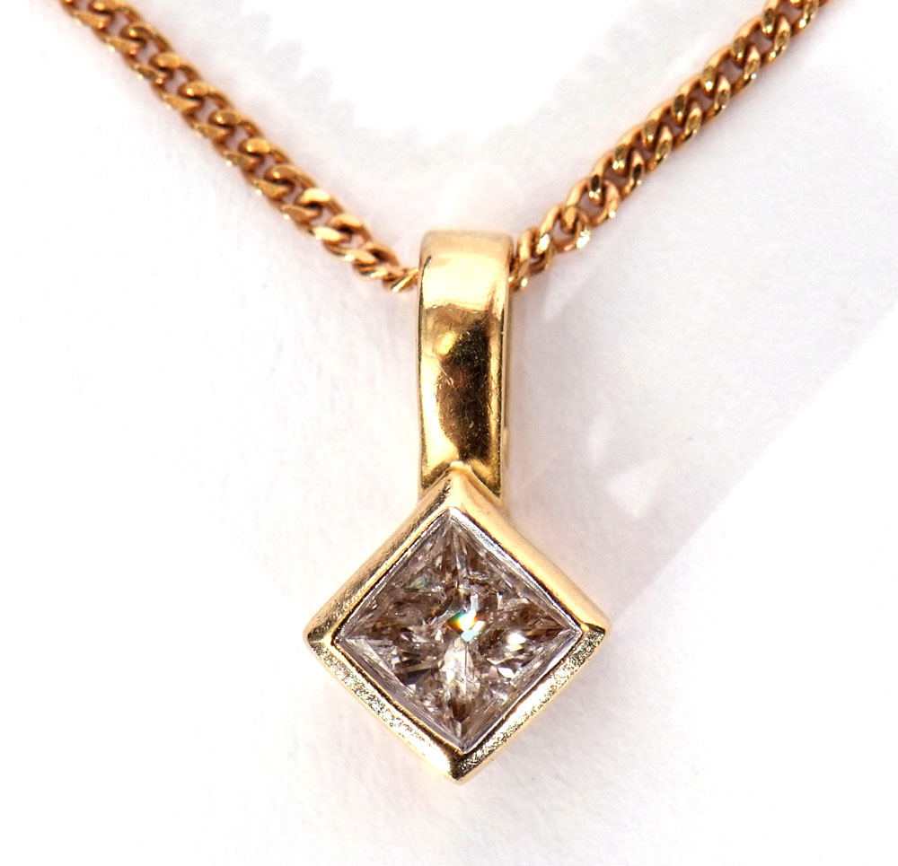 Diamond pendant, the round brilliant cut diamond collet set, 0.45ct approx, suspended from a 9K