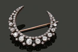 Late Victorian diamond crescent brooch, the closed crescent set overall with graduated old