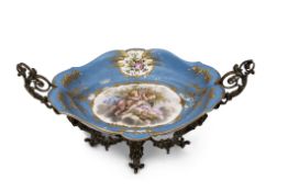 19th century Sevres style centrepiece, the porcelain bowl supported in a gilt scrolling frame, the