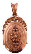 Yellow metal oval shaped locket, the centre applied with a seed pearl decorated flower, the top with