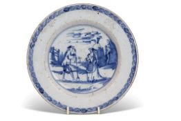 18th century English Delft plate, the centre painted with two figures in a landscape within scroll