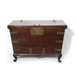 19th century mahogany coffer of tapering rectangular form, brass studded top and front, applied on